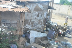 Just around the corner from the Voodoo Market I found this family living on the corner .