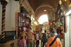 Walking and looking at all the items for sale in the Tunis Central Market.