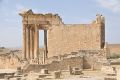 Side view of The Capitol.  In front of photo are the pillars of the Temple of Mercury