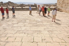 A sun dial is carved into the stone and was used daily in its time. 