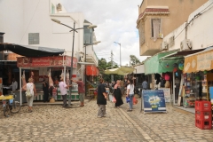 Small plaza area with lots of produce and lamb