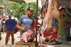 Local butcher busy at work. 