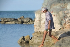 Here we find a fisherman showing us some of the crab that is locally found in the waters. 