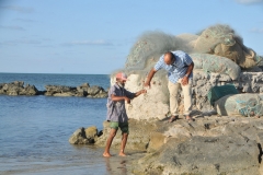 He is giving the crap to Mohamad to show us in the following photos.