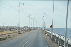 Pipe alongside the highway to carry water to outlying areas. 