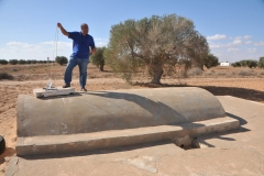 Many agricultural areas have their own wells. This photo shows an item where by travelers can find water from a well and can take it to use while driving along the highway.  You can pull the item out and retrieve some water.  