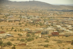 Rural area below as we begin to climb up into the hilly areas. One gets an idea of how their homes are set up and the property with them. 