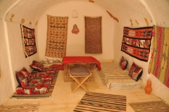 Notice the bright colors for the area we would call the sitting room or living room of the cave home. 