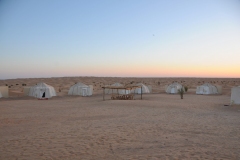 During the night after the moon had set, I went outside and just starred up at the stars, galaxies and nature.  It was an awesome sight. There is no light pollution in the Sahara.  The Milky Way is so spectacular. The stars are bright, millions of them.  I saw a falling star race across the sky.  I really did not want to go back inside the tent even though the temperature had chilled down into the night.  I must have spent 45 minutes just taking the heavens in.  Then at the first crack of dawn I was back outside again to catch the first rays of the sun casting the early morning rays of light across the sprawling sand dunes.  