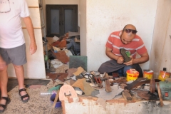 A cobbler making shoes by hand. 