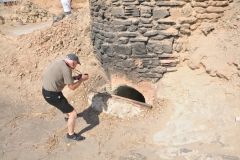 Bill looking at the kilm that is used to bake the bricks once they are made and dried in the sun. 