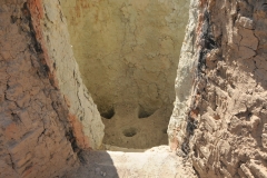 View looking into the kiln. A kiln a thermally insulated chamber, is a type of oven, that produces temperatures sufficient to complete some process, such as hardening, drying, or chemical changes. Kilns have been used for millennia to turn objects made from clay into pottery, tiles and bricks.
