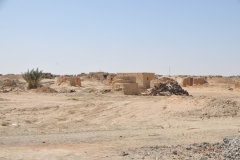 Located close by are other people making bricks in the same way. 