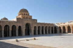 During the eighth century, the mosque was rebuilt at least twice as Kairouan prospered. However, the mosque we see today is essentially ninth century. The Aghlabids , 800–909 AD were the semi-independent rulers of much of North Africa. In 836, much of the mosque was down most of the earlier mudbrick structure and rebuilt it in more permanent stone, brick, and wood. The prayer hall or sanctuary is supported by rows of columns and there is an open courtyard.