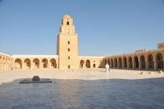 The inner courtyard is immense in size.  We have now entered the town of Kairoun. Kairoun is the most ancient Arab Muslim base of the Maghreb, 670 AD, and one of its principal holy cities. in Tunisia.  The Great Mosque, rebuilt in the 9th century, is not only one of the major monuments of Islam but also a universal architectural masterpiece.