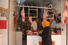 Fresh meat  or lamb anyone. Note the temperature of the refrigeration.. oh what refrigeration?  The meat is left hanging in the open air until sold. 