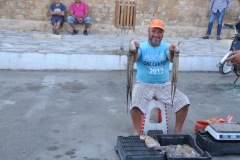  We departed early this morning Kairouan driving north with a stop in Hammamet, a town of white washed houses and beautiful beaches.  We walk around the town and find this man selling squid. 