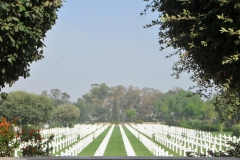 Headstones are set in straight lines subdivided into nine rectangular plots by wide paths, with decorative pools at their intersections.