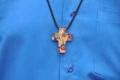 He was wearing the  most unique cross I have seen on visits to many churchs around the world.