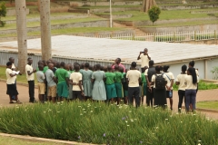 Students stopping for a photo outside in the gardens to the side of the Basilica.