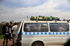 Mini van bus to the outlaying areas. Note the fruit from the market on the top of the van.
