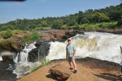 The sheer force of the water so close shakes the ground as you stand near the force of the water.