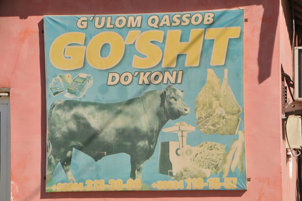 Here is the sign in person... promoting the bull that is in Uzbekistan writing