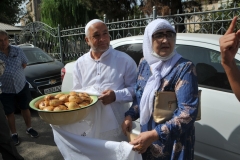 Here they are showing us the home made bread roles made by the wife in the photo.