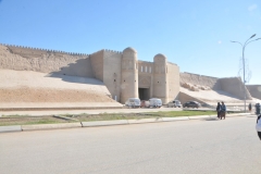 We are now in the town of Khiva.  Khiva is split into two parts. The outer town, called Dichan Kala, was formerly protected by a wall with 11 gates. The inner town is encircled by brick walls, whose foundations are believed to have been laid in the 10th century. Present-day crenellated walls,  a pattern along the top of a parapet,  a fortified wall, most often in the form of multiple, regular, rectangular spaces in the top of the wall, through which arrows or other weaponry may be shot, dates back to the late 17th century and attain the height of 30 feet.