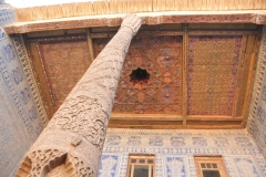 Intricate ceilings, tile and carvings on the wooden support poles