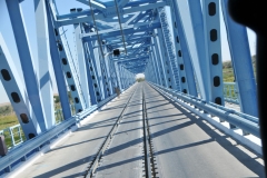 We discover the bridge and road is shared with the local railroad. Notice the tracks on the bridge.