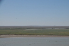 After our break stop we travel for hours through the Kyzyl-kum Desert.  In the distance we see the border of Turkmenistan.