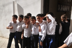 Children coming out of their classroom in a local school as we walked by.