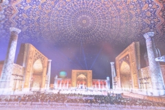 A night time photo of Registan Square take from a poster.