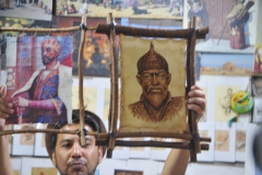 Aziz holding a drawing of Genghis Khan  ....a rare if any depiction of what he looked like.